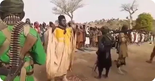 Armed insurgents gathered in formation during a public prayer session in Borno State