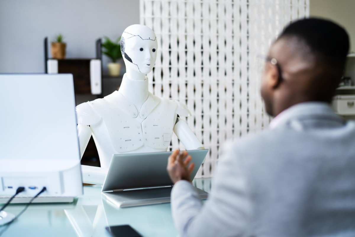 Nigerian student using AI tools on laptop and tablet for studying and research in 2026